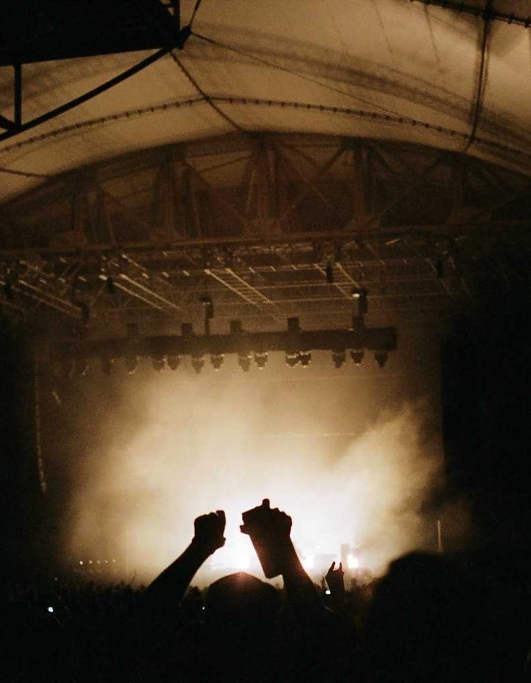 Silhouettes in a warm, hazy hall